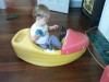 little boy in a boat