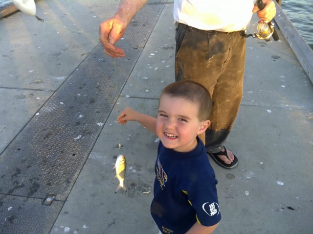 Young fella catching herring at leeman