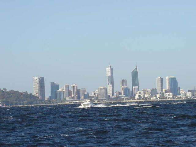 Perth City and a big boat in foreground.